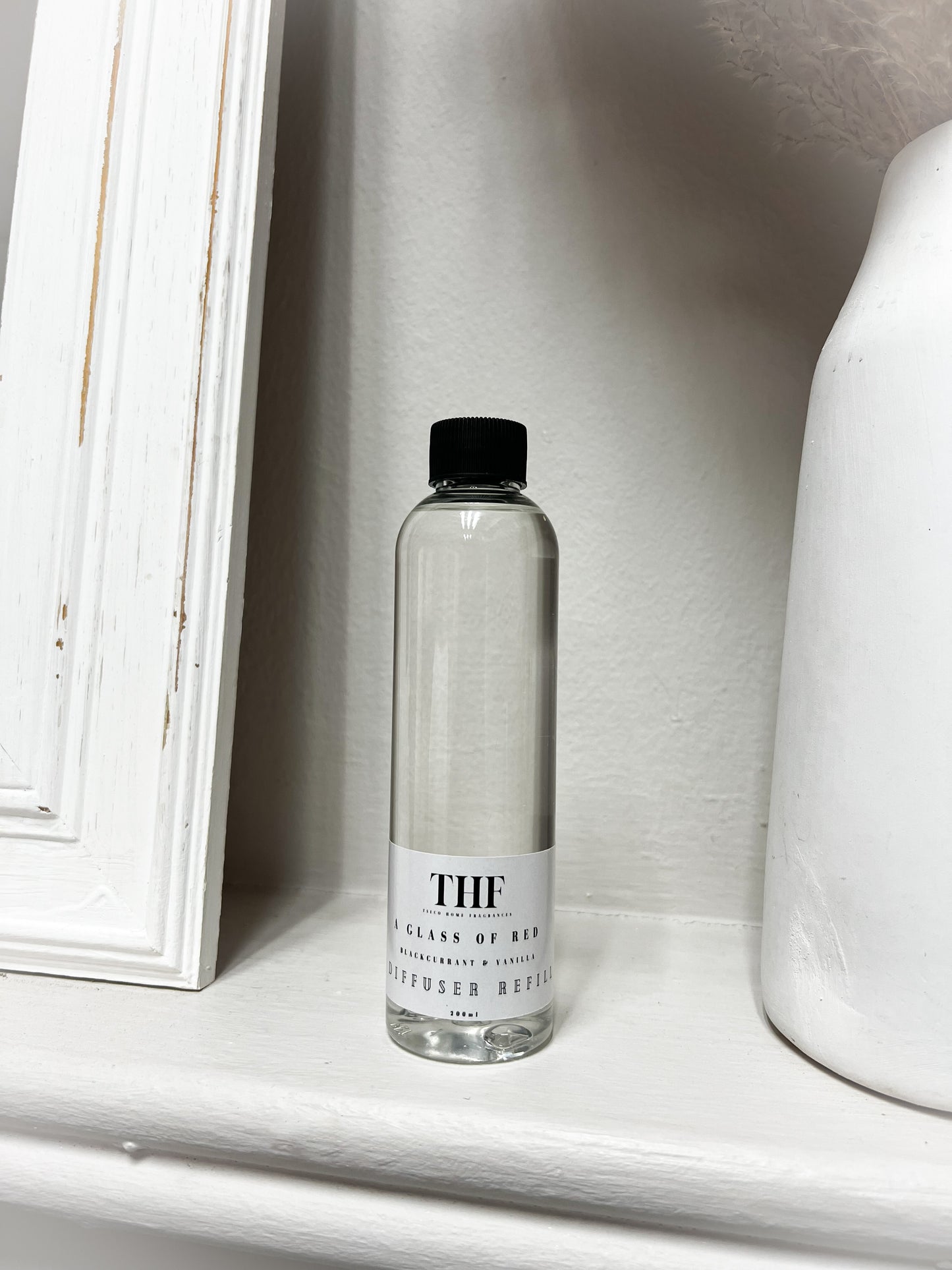 A glass of red Diffuser Refill