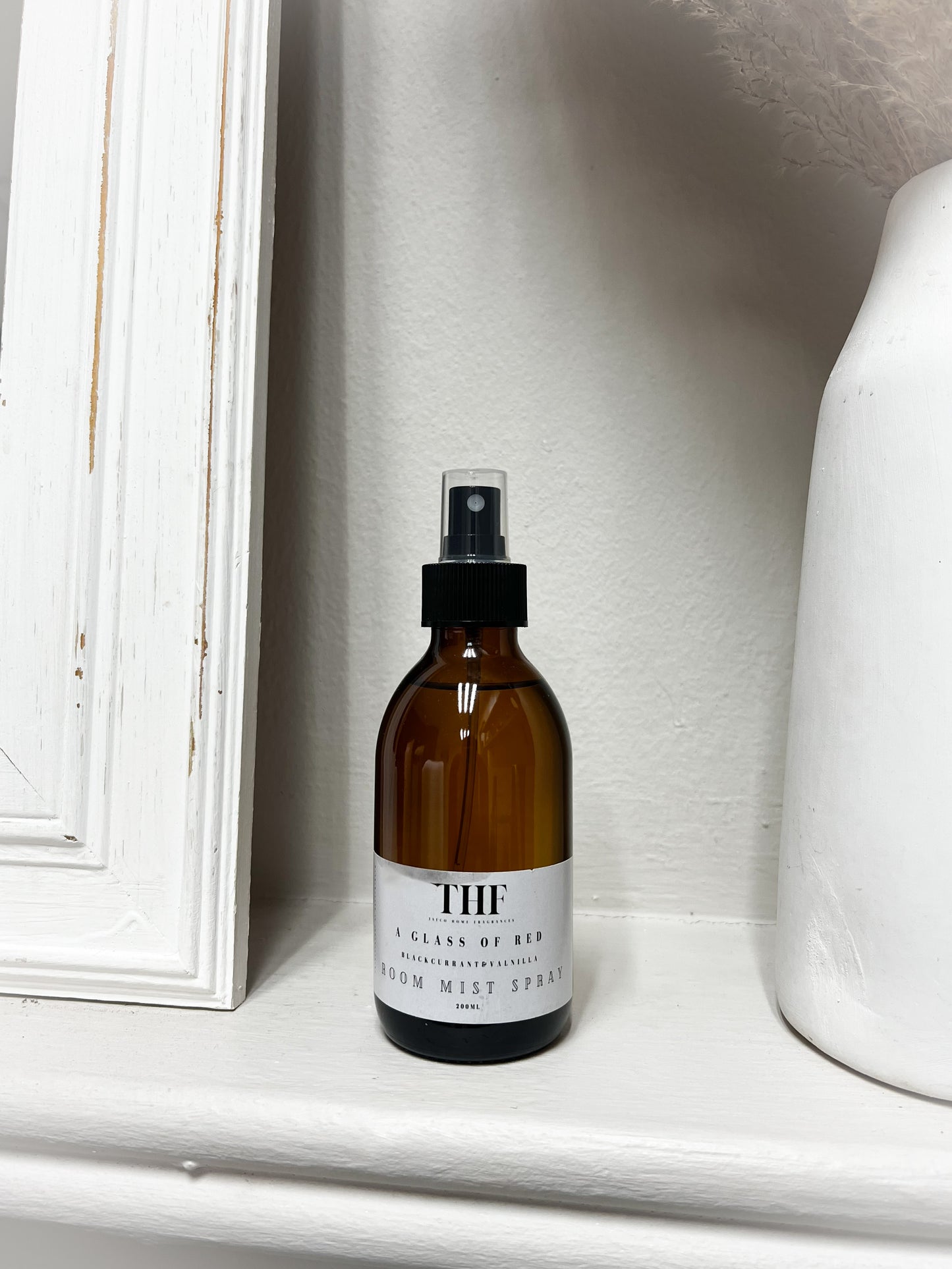 A glass of red room mist