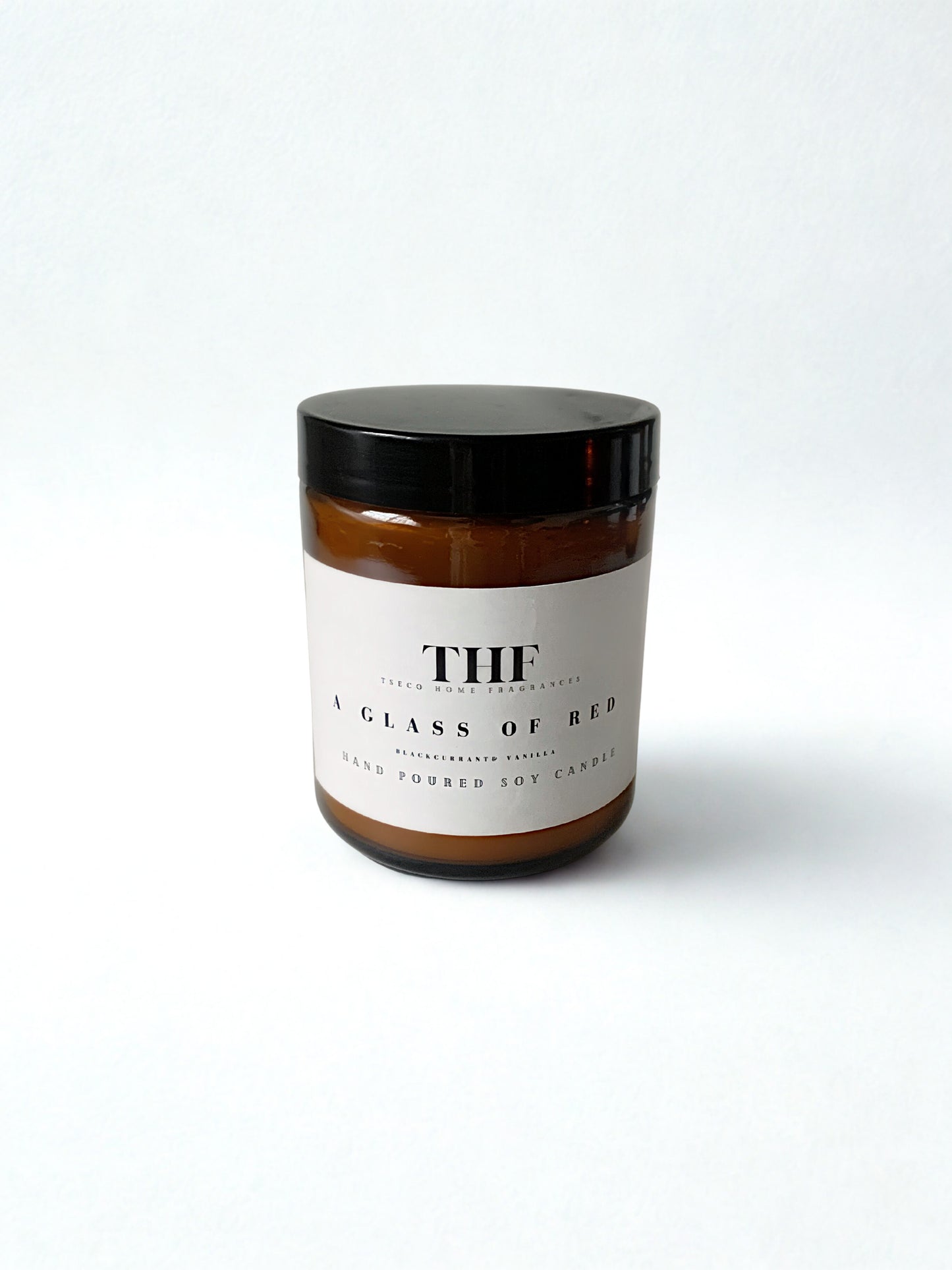 A glass of red candle